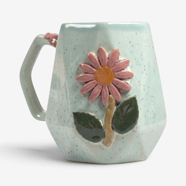 Ayethic Angular Blossom ceramic mug with a faceted light blue speckled finish and a sculpted pink flower motif.