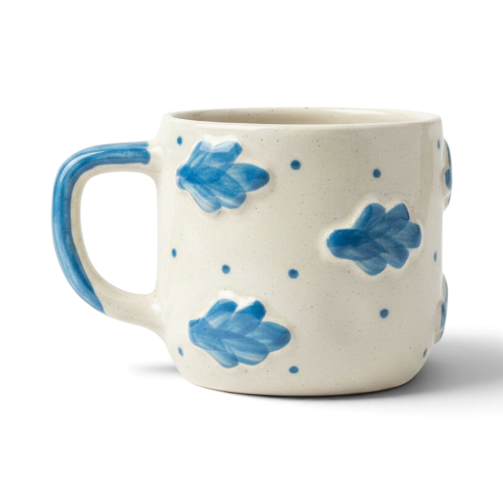 Ayethic Celestial Cloud ceramic mug with hand-painted blue leaf and dot patterns on a cream satin glaze finish