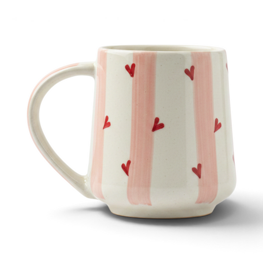 Ayethic handcrafted ceramic mug with hand-painted pink stripes and small red scattered hearts on a cream background.