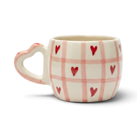 Ayethic handcrafted ceramic mug with pink checkered pattern and red hearts, featuring a heart-shaped handle.