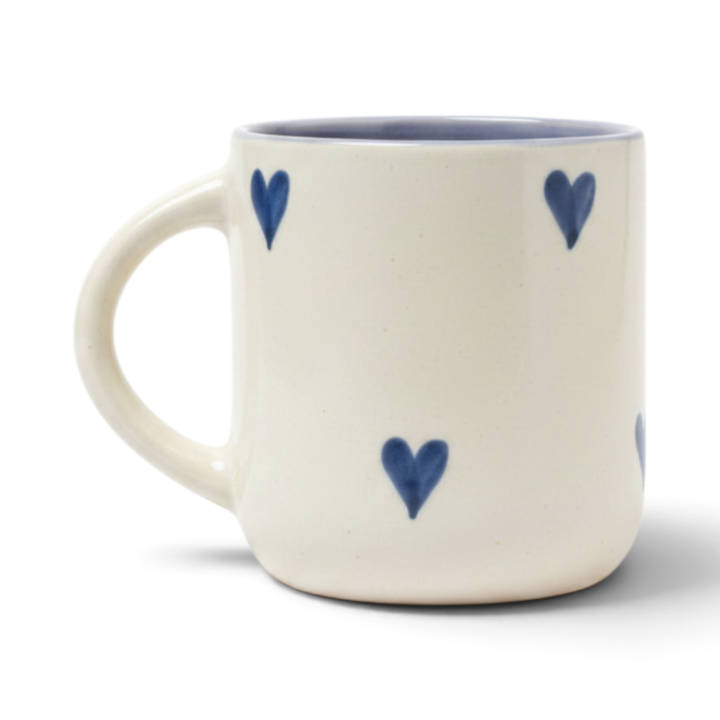 Ayethic handcrafted ceramic mug in cream with hand-painted blue hearts and a smooth satin glaze finish.
