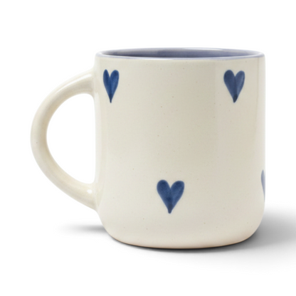 Ayethic handcrafted ceramic mug in cream with hand-painted blue hearts and a smooth satin glaze finish.
