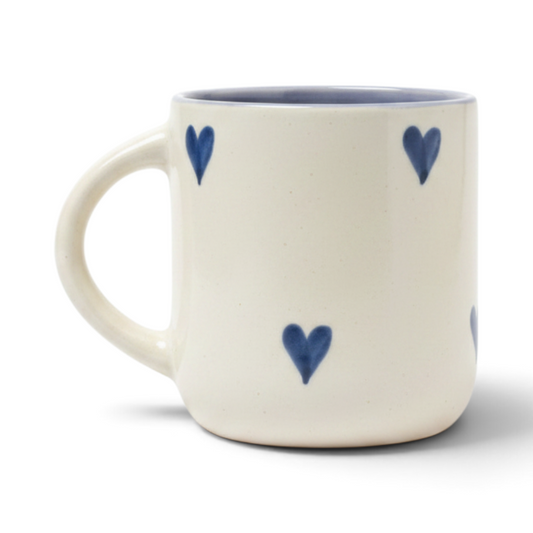 Ayethic handcrafted ceramic mug in cream with hand-painted blue hearts and a smooth satin glaze finish.