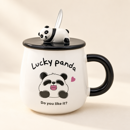 Fortune Panda ceramic mug with black handle, panda-topped lid and spoon on an ivory background. Panda design is supplied at random.