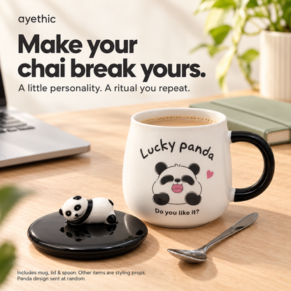 Fortune Panda mug holding chai on a work desk, with its lid and spoon. Other items are styling props; panda design is supplied at random.