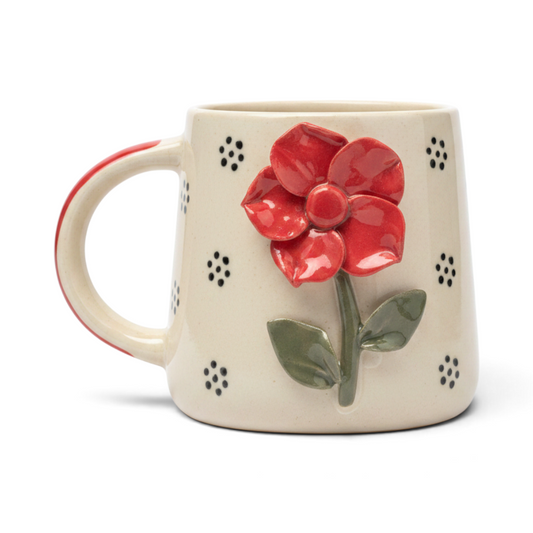 Ayethic handcrafted ceramic mug featuring a sculpted red flower and black polka dots on a cream background