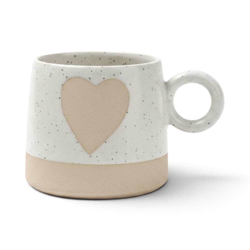 Ayethic handcrafted ceramic mug with a speckled white finish, a beige heart design, and a round handle.